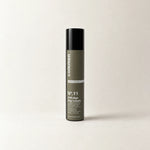 Commen Nº.11 Anti-Age Day Cream, a slim 50 ml airless pump bottle with an olive label, standing on light paper.