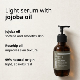 Commen Nº.16 Citrus Body Serum lying on light paper, with jojoba oil and rosehip oil in a light serum.