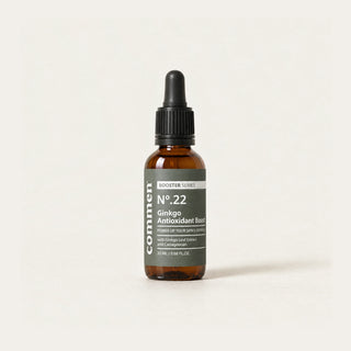 Commen Nº.22 Ginkgo Antioxidant Boost, an amber dropper bottle with a dark label, standing on light paper.